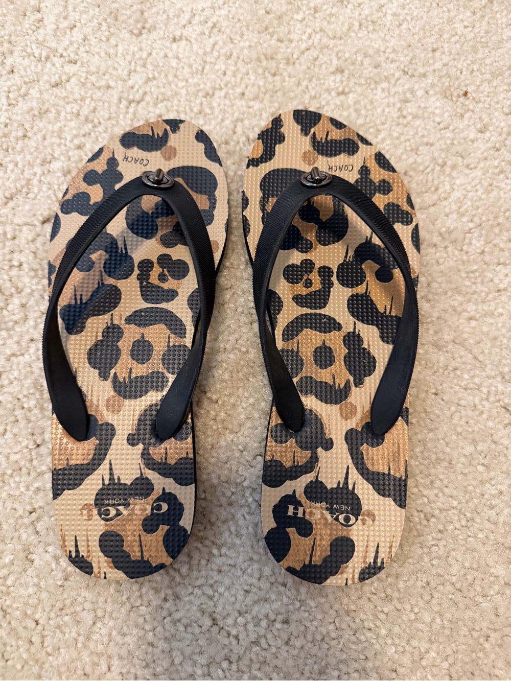 Coach Leopard-Pattern Flip Flop Sandals in Tan and Black